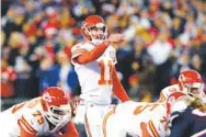  ??  ?? Kansas City Chiefs quarterbac­k Alex Smith (11) threw for 246 yards Saturday against the New England Patriots but needed 50 passes to do it. Elsa, Getty Images