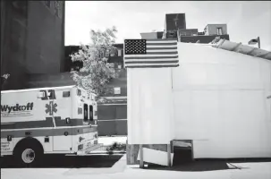  ?? REUTERS/Mike Segar/File Photo ?? An ambulance is seen backed up to a temporary morgue outside Wyckoff Heights Medical Center in Brooklyn, during the outbreak of the coronaviru­s disease (COVID-19) in New York City, New York, U.S., May 27, 2020.