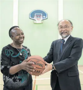  ?? Bega Picture: Michel ?? GENEROUS BENEFACTOR: Orlando Children’s Home project director Solani Mirriam Mazibuko with Japanese diplomat Yasushi Naito in the home’s new hall and sports facility, donated by Japan.