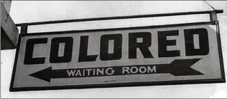  ?? LIBRARY OF CONGRESS ?? A sign at the Greyhound bus station in Rome, Ga., in 1943 speaks of a different America.