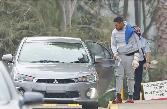  ??  ?? Out you go: Former Fijian rugby league internatio­nal Ratu Nanovo, 20, shuffled out of Silverwate­r prison in his scarlet flip-flops last Friday afternoon.