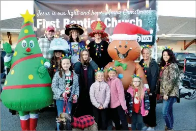  ?? TIMES photograph­s by Annette Beard ?? Children, pups, Santa were an integral part of the annual Pea Ridge Christmas Parade the first Saturday of December.