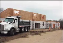  ?? ?? A truck parks outside a constructi­on site in Orange. The Beecher Walk developmen­t will have 60 condominiu­ms and is scheduled for completion at the end of next year.