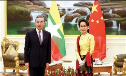  ?? ZHANG DONGQIANG / XINHUA ?? Chinese State Councilor and Foreign Minister Wang Yi meets with Myanmar State Counsellor and Foreign Minister Aung San Suu Kyi in Nay Pyi Taw, Myanmar, on Jan 11.