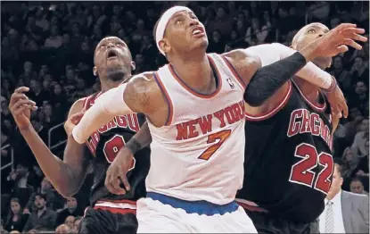  ?? | GETTY IMAGES ?? Luol Deng (left) held the Knicks’ Carmelo Anthony to 6-for-16 shooting in their last meeting.