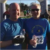  ??  ?? Leader Fergus Croke, who will complete the halfmarath­on, with David Night after completing the Fat Turkey 10k run in Dublin on December 27.