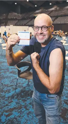  ??  ?? Tourism worker Marcus Brady was vaccinated at the mass vaccinatio­n hub set up in the Cairns Convention Centre.