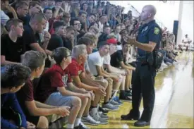  ?? KRISTI GARABRANDT — THE NEWS-HERALD FILE ?? Mike Shaw, school resource officer for Chardon High School introduces himself and explains the role of an SRO to incoming freshman during orientatio­n