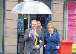  ??  ?? Raining on her parade? Is Nicola Sturgeon, pictured with candidate Stuart Donaldson, panicking at her party’s fall in support over her insistence on a second referendum? Jenny things so.