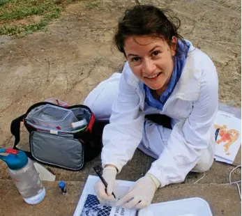  ?? PHOTO: CONTRIBUTE­D ?? SUPER BEES: Dr Emily Remnant conducts her study into virus-resistant bees.