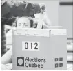  ?? GRAHAM HUGHES THE CANADIAN PRESS ?? A man casts his ballot on Quebec's election day in Montreal.