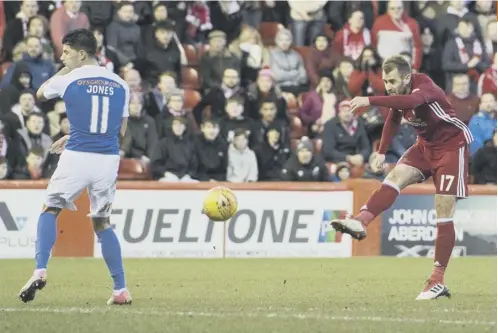  ??  ?? 0 Niall Mcginn, after running half the length of the pitch, unleashes a superb strike to put Aberdeen 3-1 ahead.
PICTURE: GARY HUTCHISON/SNS