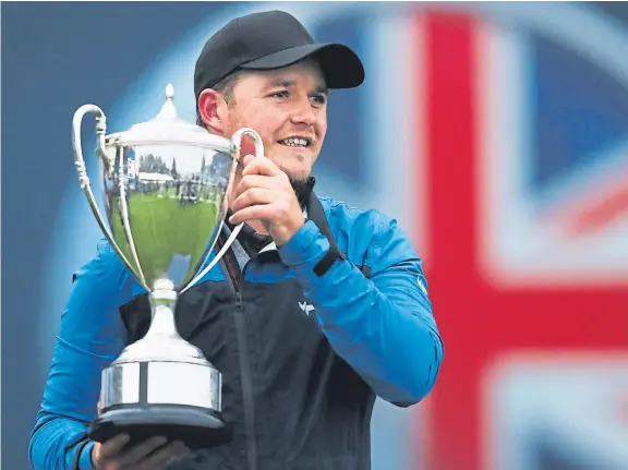 ?? Getty. ?? Eddie Pepperell with the British Masters trophy, with his victory more or less securing him an appearance at Augusta next year.