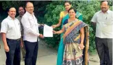  ??  ?? GHMC officials accept the approval letter from the management of St Joseph’s School, Habsiguda, allowing citizens to use the school playground, provided they carry a photo ID card.