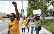  ?? ?? Kamilah Miller, left, and others take part in a march after a tenants’ rights rally at the Delta Pines apartment complex in Antioch on Wednesday.