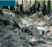  ?? ?? In una fossa comune scoperta in una foresta, sono stati ritrovati i cadaveri della sindaca Olga Sukhenko, del marito e del figlio