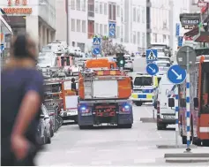  ??  ?? Emergency servies work at the scene where a truck crashed into the Ahlens department store at Drottningg­atan in central Stockholm.