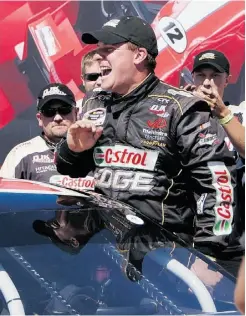  ?? Ian Stewart , Edmonton
Journal ?? D.J. Kennington emerges from his Castrol Dodge after winning Sunday’s NASCAR Canadian Tire Series Race in Edmonton.