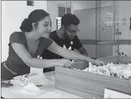  ?? ERICA MOSER/THE DAY ?? Three Rivers Community College students Kyra Monahan and Joaquin Lopez-Watson use their break in between classes Wednesday to build with Legos in the pop-up makerspace.