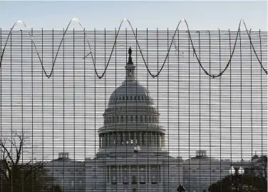  ?? J. Scott Applewhite / Associated Press ?? Police are asking to bring back fencing that surrounded the U.S. Capitol for months after the Jan. 6 riot.