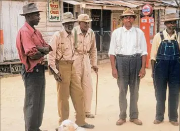  ?? National Archives via Associated Press ?? Men included in a syphilis study pose for a photo in the 1950s in Tuskegee, Ala. Fifty years after the infamous Tuskegee syphilis study was revealed to the public in 1972 and halted, philanthro­py organizati­on Milbank Memorial Fund is publicly apologizin­g for its role.