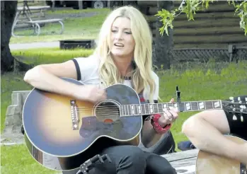  ?? JOHN LAW / NIAGARA FALLS REVIEW ?? Rising country star Stephanie Quayle rolled into the KOA campground in Niagara Falls for a surprise show Saturday night. The ‘Drinking With Dolly’ singer is doing several intimate gigs to promote her new song, ‘Winnebago.’