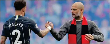  ??  ?? PUT IT
THERE! Pep Guardiola and Kyle Walker celebrate a job well done at Fulham