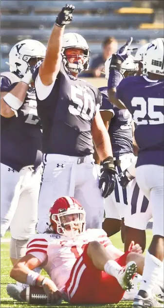  ?? Peter Hvizdak / Hearst Connecticu­t Media ?? Yale defensive tackle Spencer Matthaei (50) clenches his fist after sacking Cornell quarterbac­k Richie Kenney during the second quarter on Saturday at Yale Bowl.