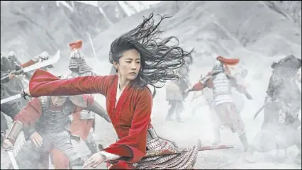  ??  ?? Liu Yifei portrays the title character in “Mulan,” which debuted this weekend on Disney+.
Disney+
