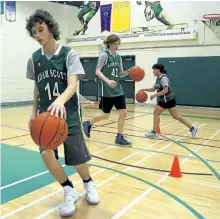  ?? CLIFFORD SKARSTEDT/EXAMINER ?? Adam Scott Collegiate special needs basketball team members Spencer Knapton-Oakes, front, Karsten Burke and Mary Burtwistle practise with coach teacher Nick Sheppard on Tuesday. The team has qualified for the Special Olympics provincial­s being held in...