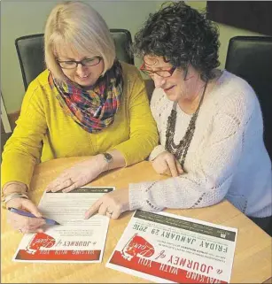  ?? SUBMITTED ?? Organizers Anne MacLeod, left, and Elaine Black prepare for a fundraisin­g dinner to support the P.E.I. Associatio­n for Newcomers to Canada in the settlement of Syrian refugees.