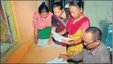  ?? PTI ?? Bodo women check their names in the final list of the NRC at a Seva Kendra in Baska district of Assam on Sept 2, 2019.