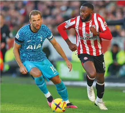  ?? Photo: Reuters ?? Tottenham Hotspur’s Harry Kane (left) in action with Brentford’s Josh Dasilva at Brentford Community Stadium, London, Britain on December 26, 2022.