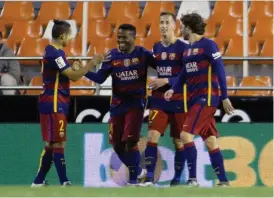  ?? — AFP ?? Barcelona forward Wilfrid Kaptoum ( second from left) celebrates his goal with team mates in their Copa del Rey semi- final second leg match against Valencia at the Mestalla Stadium in Valencia on Wednesday. The match ended 1- 1.