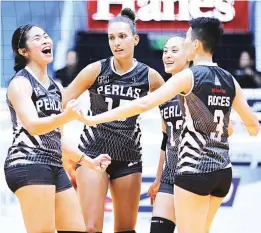  ??  ?? Members of the triumphant Perlas Spikers squad celebrate their straight sets win over the Power Smashers yesterday in the Philippine Volleyball League at the Arena in San Juan. (Rio Deluvio)