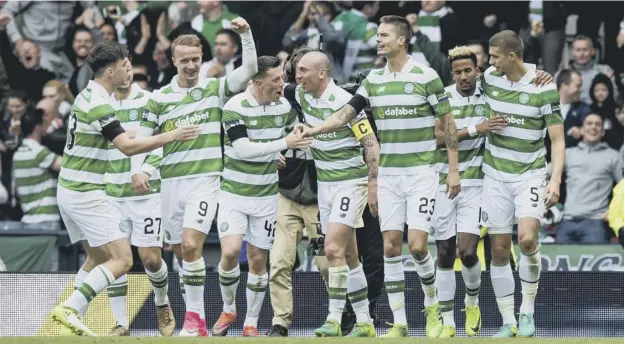  ?? PICTURE: CRAIG WILLIAMSON /SNS GROUP ?? 0 Celtic players celebrate after Scott Sinclair converted the 51st minute penalty which sealed their place in the Scottish Cup final.