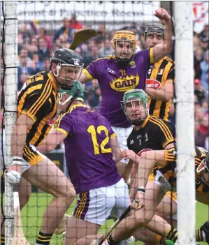  ??  ?? David Redmond celebrates after forcing the ball into the net at the Clonard end early in the second-half.