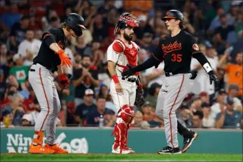  ?? MICHAEL DWYER, AP ?? Baltimore Orioles superstars Adley Rutschman, right, and Gunnar Henderson both finished in the top 10of American League Most Valuable Player voting last season.