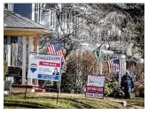  ??  ?? Postal worker Charles Baker delivers mail Tuesday.
The housing market continues to be red hot and area real estate profession­als say buyers are feeling the burn.