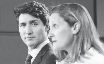  ??  ?? Canada’s Prime Minister Justin Trudeau listens to Foreign Minister Chrystia Freeland during news conference in Ottawa, Ontario, Canada, May 31, 2018. (Reuters photo)