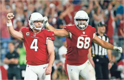  ??  ?? Arizona kicker Phil Dawson celebrates after hitting a 57-yard field goal with one second left to give the Cardinals a 27-24 upset win against Jacksonvil­le. MICHAEL CHOW/THE ARIZONA REPUBLIC