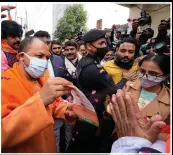  ?? (AP/Rajesh Kumar Singh) ?? Adityanath campaigns door to door Saturday for upcoming state assembly elections in Gorakhpur, India.