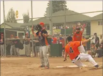  ??  ?? Dylan Solberg (24) of the Alberta Oilmen gives teammate Josh Zanolli the signal to slide into home plate during the first game of the championsh­ip final of the 2018 Men’s Canadian Slo-Pitch Championsh­ip against the Ontario 1 Miken/Kahunavers­e Sports/Millwood Logistics Orioles Saturday afternoon at Softball Valley.