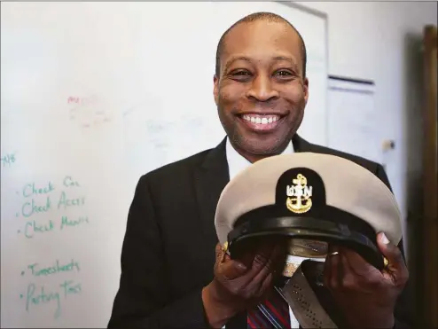  ?? Brian A. Pounds / Hearst Connecticu­t Media ?? West Haven Finance Director Scott Jackson was surprised to acquire his father’s Navy cap. Marion “Charles” Jackson was a career Navy chief petty officer on the aircraft carrier U.S.S. Intrepid.