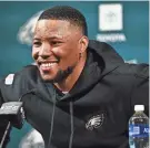  ?? KYLE ROSS/USA TODAY SPORTS FILE ?? Eagles running back Saquon Barkley talks with reporters after signing with the team.