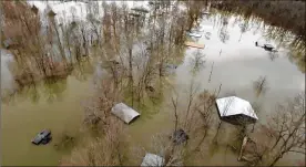  ?? CONTRIBUTE­D BY MELVIN MARTIN / HARDIN COUNTY FIRE DEPARTMENT, SAVANNAH, TENN. ?? This drone photo provided by the Hardin County Fire Department shows flooding Saturday in Savannah, Tennessee. Days of heavy rain have created a dilemma for authoritie­s managing dams along swollen rivers in Mississipp­i and Tennessee.