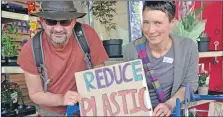  ??  ?? Marc Headley and Moira Newiss were campaignin­g outside Tesco to reduce plastic use.