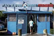 ??  ?? The Plaza Seafood Market is a hub of sounds, sustenance and a sense of community.