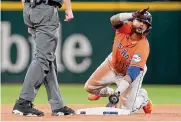  ?? Karen Warren/staff photograph­er ?? Martín Maldonado drove in a pair of runs with his first-inning single Wednesday night in Arlington.