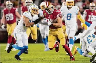  ?? Thearon W. Henderson/Getty Images ?? Niners tight end George Kittle had one catch for 21 yards against the Chargers on Sunday.